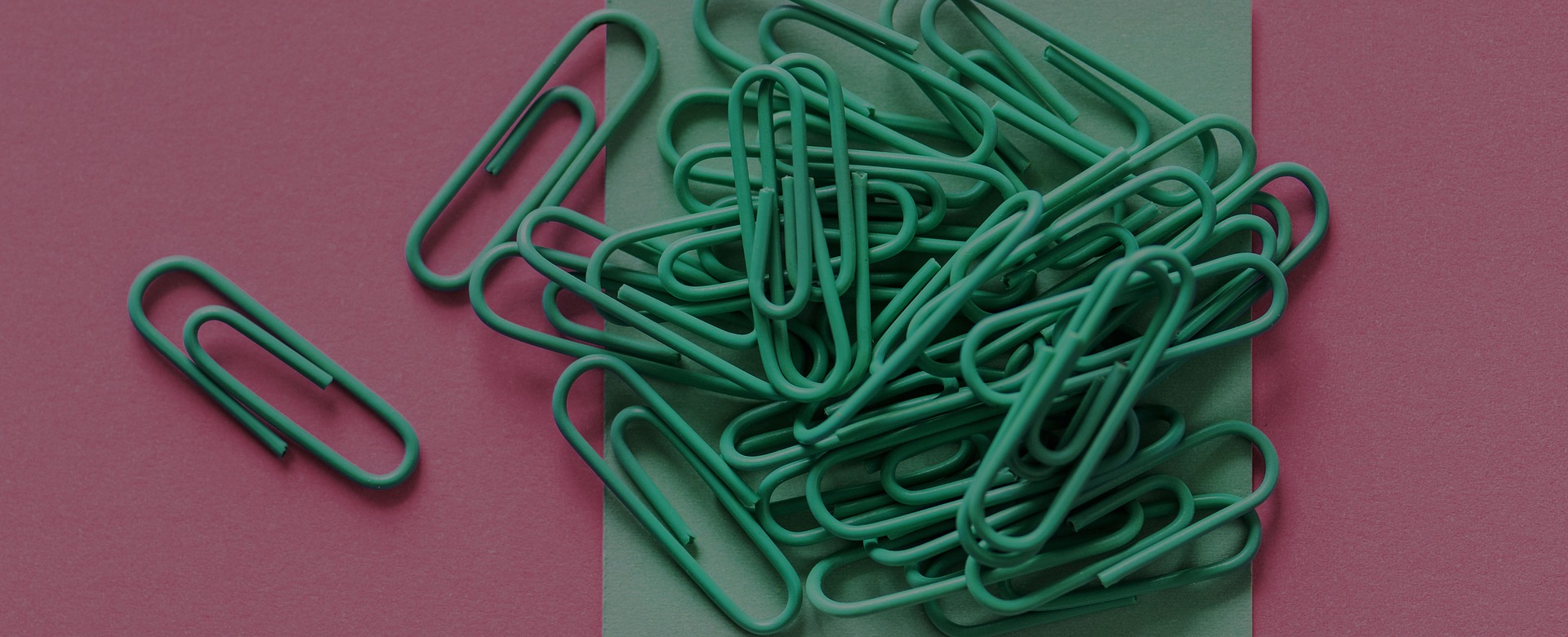 Paper clips representing file attachments.