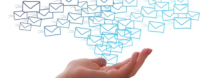 An illustration featuring many mail envelopes floating above a hand against a white background.